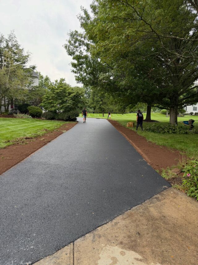 Why backfill the edges after paving a driveway?

Backfilling is an important final step after paving. It supports the outside edges of the asphalt, helping prevent cracking, crumbling, and edge failure over time. It also eliminates the drop-off along the driveway and gives the finished job a clean, seamless transition into the lawn.

A little extra work at the end goes a long way toward protecting the driveway for years to come.

Hicks Paving
